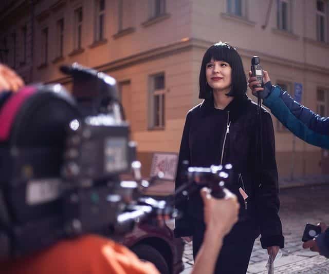 Student holding a spot meter, Acting for Film